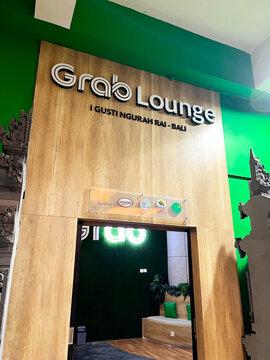 The entrance signage for the Grab Lounge and Circle K partner pickup point at I Gusti Ngurah Rai International Airport (DPS), the main airport - Bali, Indonesia, March 18, 2023