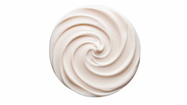 Swirled white cream in a circular shape on a white background