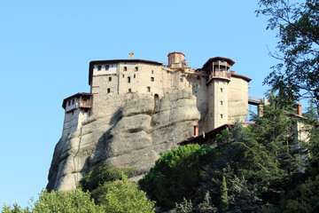 Fototapeta premium Rousanou Monastery Meteora August 2024 Ancient stone convent on steep rock cliff