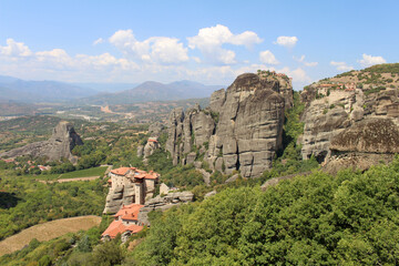 Fototapeta premium Holy Monastery of Rousanou August 2024 Orthodox nunnery on rock pillar as seen from Great Meteoron and Varlaam Monastery