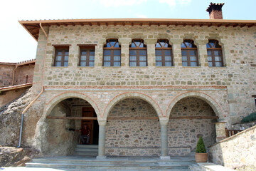 Fototapeta premium Meteora Agia Triada Courtyard August 2024 Arched stone masonry architecture historic monastery