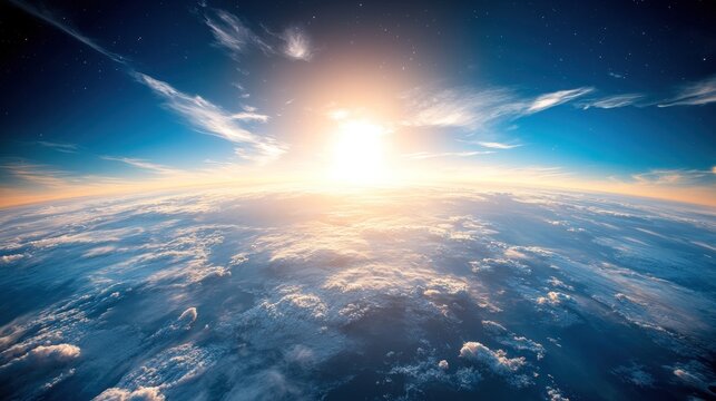 Sunrise over earth atmosphere with clouds and sun