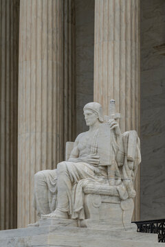 Authority of Law allegory sculpture. Supreme court neoclassical architecture. Law lex constitution power. Historic courthouse landmark.