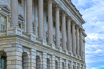 Naklejka premium Columns marble Tall vertical perspective. Columns fluted symmetry pattern. Columns decorative capitals ornament Sculpture. Columns heritage classical structure.