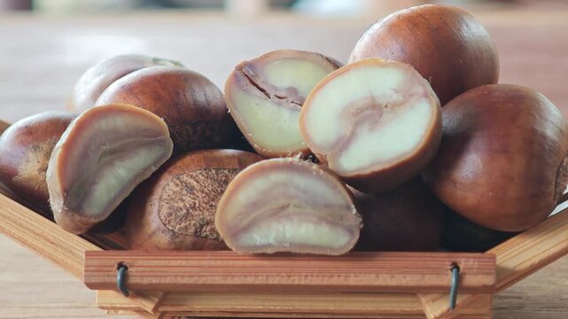 Roasted chestnuts in a container.