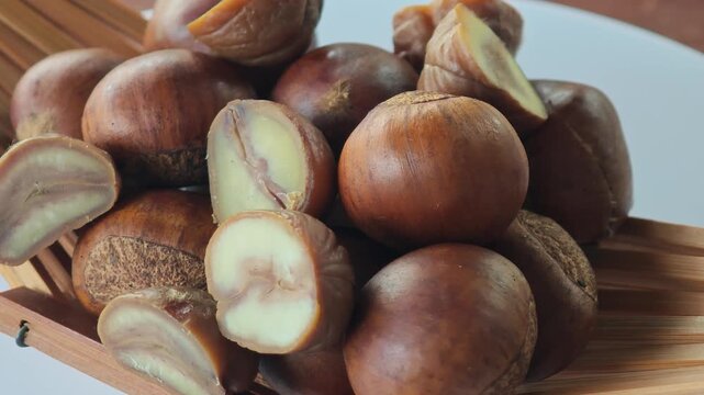 Roasted chestnuts in a container.