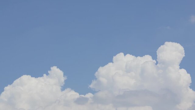 Paceful Puffy Cloud Clear Blue Sky Background