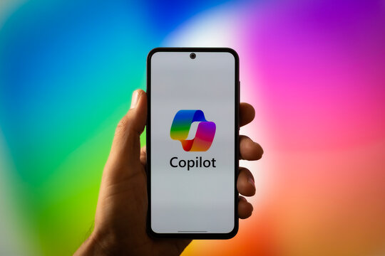 Microsoft Copilot AI Assistant Mobile Application Displayed on Smartphone in Hand Mockup
Microsoft Copilot Artificial Intelligence Chatbot and Productivity Assistant App Branding Screen Design Templat