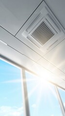 Obraz premium modern ceiling air conditioning vent releasing cool air in bright room with sunlight beams, clean minimalist interior, advanced HVAC technology
