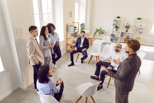 Professional office work people team is seen conducting a business group meeting in the office. This image exemplifies teamwork, communication, and professional collaboration within the workplace.