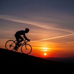 Obraz premium Silhouette of a Cyclist Riding into the Sunset - A Moment of Freedom.
