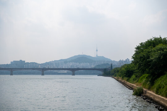View of N Seoul Tower with Seongsu Bridge and Han river on the fore ground, in Seoul, South Korea