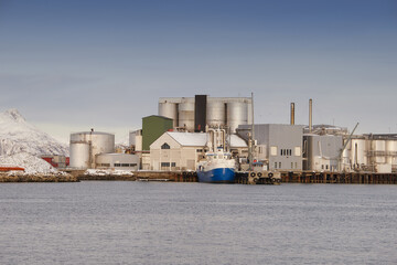 Landscape, sea and dock with buildings for shipping, global trade and industrial maritime. Space, seascape and harbor port for freight logistics, cargo ships and export industry for boat distribution