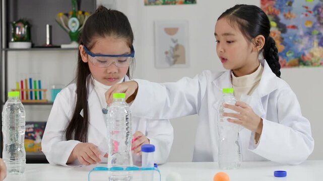 Asian Students Conduct Bernoulli Principle Science Experiment with Ping Pong Balls