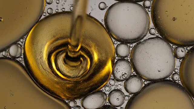 Oil Droplets in Water Mixture Closeup.
