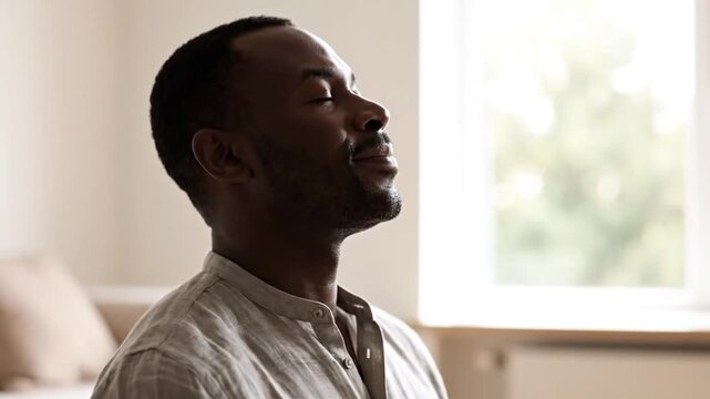 Man meditating in gyan mudra pose at home