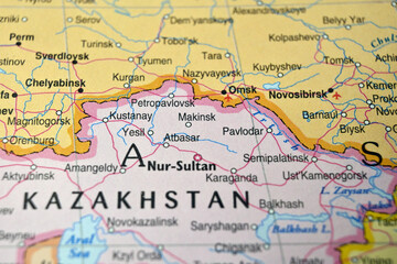 Naklejka premium Defocused Map Background Highlighting Makinsk Geography and Travel Concept