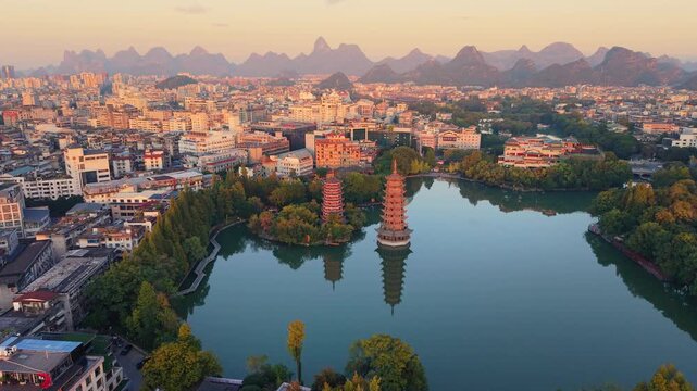 Sunrise aerial view of Sun and Moon Twin Pagodas at Shanhu Lake, Guilin, China