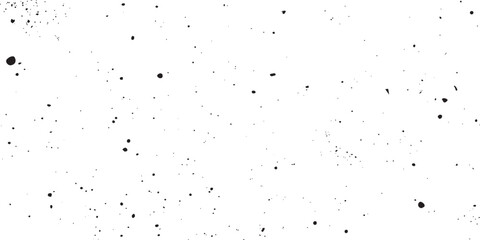 Black ink splatters and grainy dust particles on a white background