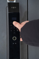 Naklejka premium Opening an outdoor smart lock by entering a code