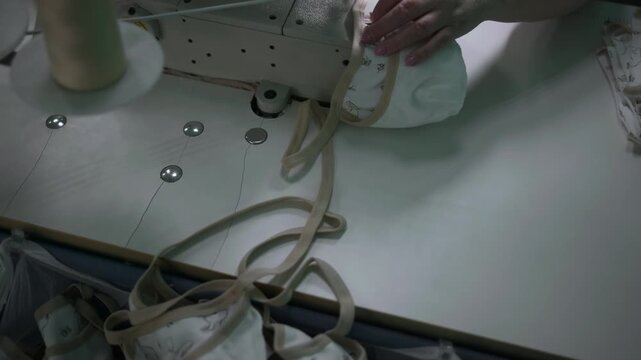 Continuous Sewing Process Of Fabric And Elastic Components Ensuring High Quality Standards. Media