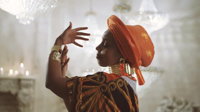 Fabulous african princess dancing in her place, medium portrait, look at camera. Arabian fairytale and cultural traditions of africa, gold bracelets on female hands, jewelry store, ethnic collection