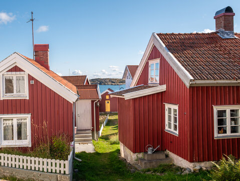 Red wooden houses and narrow passage on Gullholmen island in Bohusl&auml;n, west coast Sweden