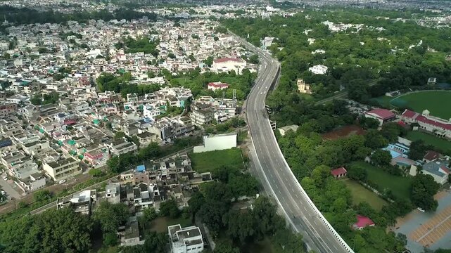 Aerial drone view of the cityscape of Patiala showing dense urban buildings, roads, and surrounding neighbourhoods from above.