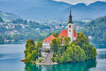 Lake Bled Island which contains several buildings, the main one being the pilgrimage church dedicated to the Assumption of Mary, built in 17th century, Lake Bled, Slovenia, Central Europe