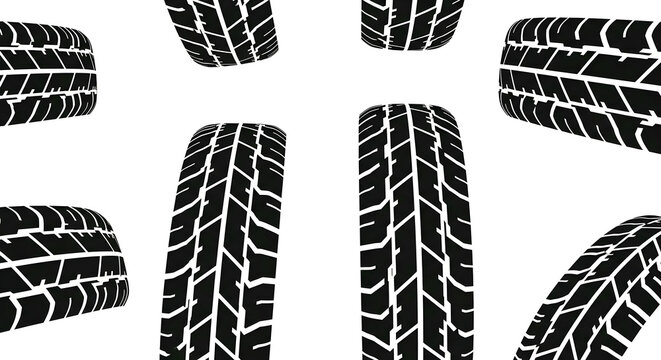 Black car tires with white tread patterns on clean white background