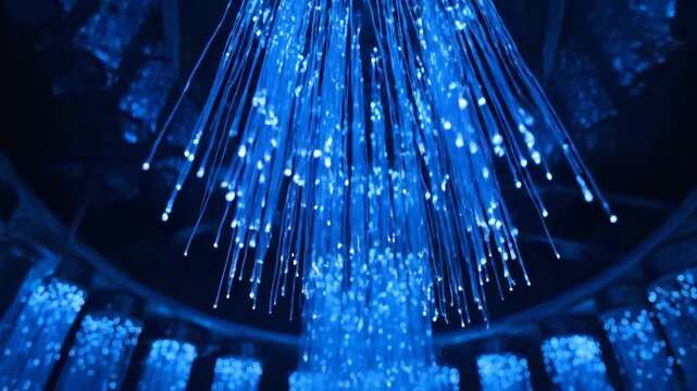 Abstract blue fiber optic light installation, illuminating in the dark. Light and technology.