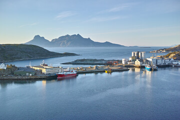 Drone, ocean and dock with buildings for shipping, global trade and industrial maritime. Space,...