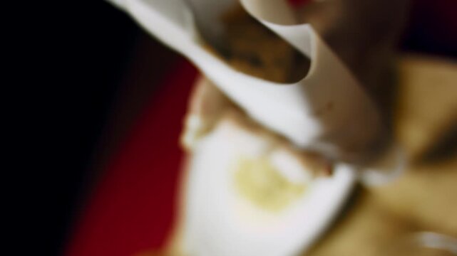 Close up of walnut paste being loaded into a pastry bag
