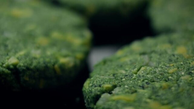 Freshly prepared spinach and cheese burger cutlet shaped by hand
