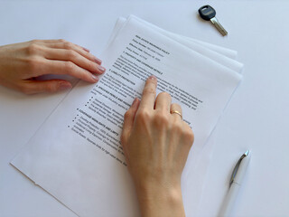 Obraz premium Side view finger pointing at contract document