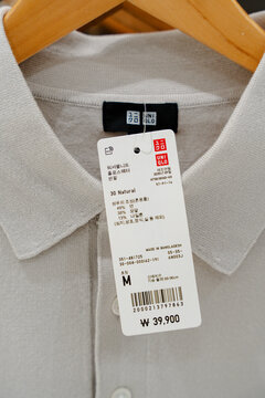 March 13, 2026, Seoul, South Korea - Close-up of a Uniqlo polo shirt with price tag displaying product details and price