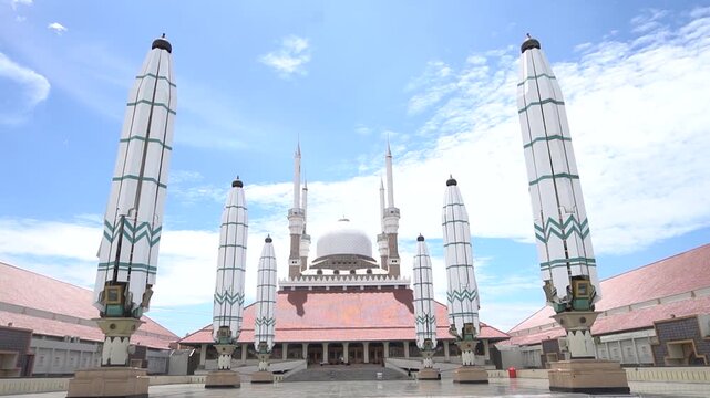 Semarang, Indonesia, October 3, 2022 : The iconic giant hydraulic umbrellas in the courtyard of the Great Mosque of Central Java in Semarang, Indonesia. The mosque complex blends traditional Javanese 
