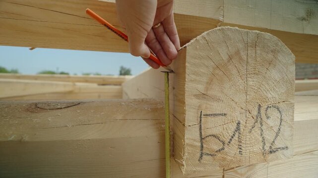 The process of assembling a wooden house from timber. Details