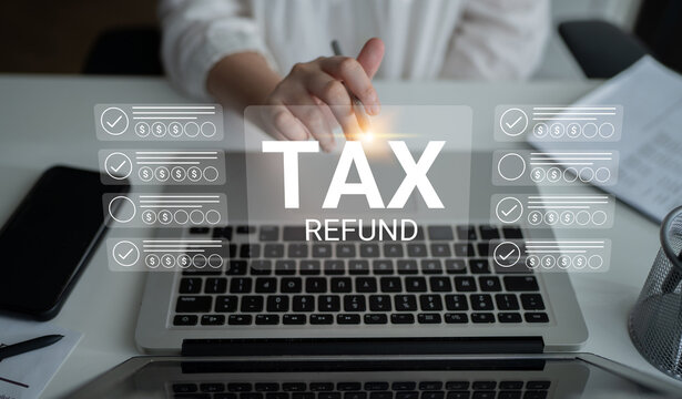 A concept image depicting the tax refund process. A hand gestures over a laptop showcasing forms with tax-related checks, emphasizing finance and efficient management in an office setting. Gantry