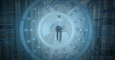 Walking man wearing light shirt, dark trousers heading down data center aisle with server racks HUD © vectorfusionart