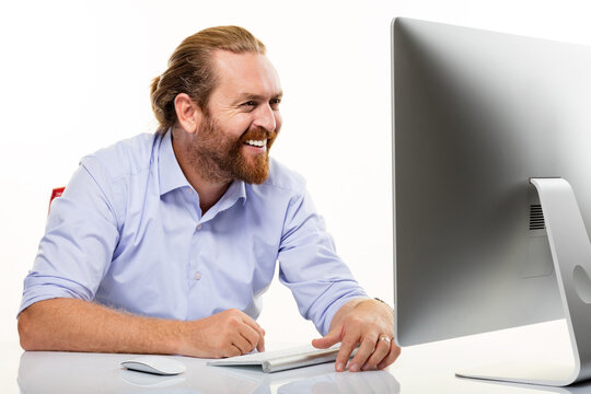 Tired businessman taking off glasses and rubbing eyes while working at office desk. Male employee suffering from eye strain, headache, or vision problems isolated on white background.