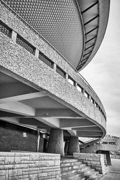 Underneath the walkway of the Spodek Arena showing massive concrete support columns and brutalist architectural details, Katowice, Slask, Poland, Europe.