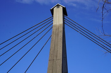 Obraz premium Pedestrian cable-stayed bridge over the Isère River in Meylan near Grenoble, France