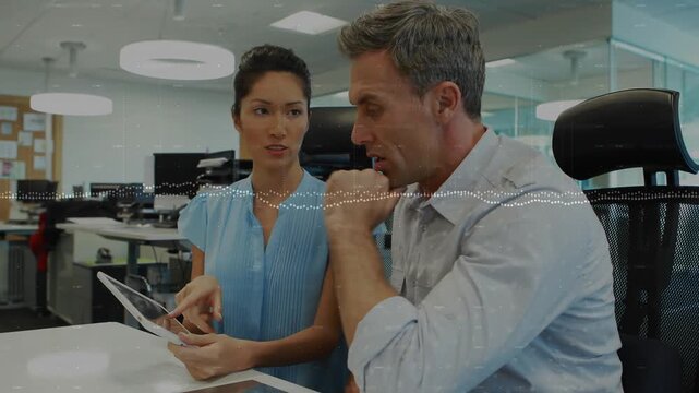 Woman holding tablet pointing man reaching tapping doing business review dotted waveform on midline