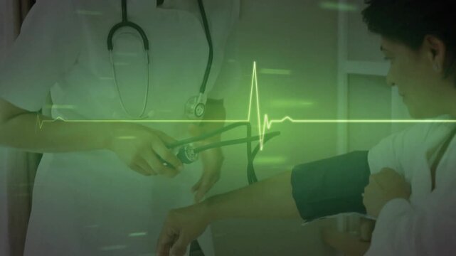 Two female clinicians placing and inflating cuff, listening for BP while ECG pulsing across frame