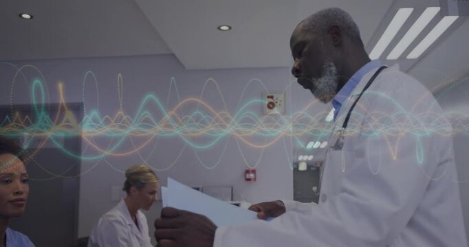 Physician reading paperwork at reception handing folder to nurse, waveform overlay marking handoff