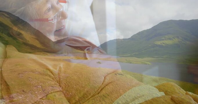 Senior woman reclining on bed becoming clearer via crossfade with lake overlay, evoking health calm