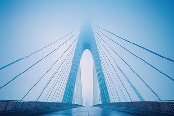 Obraz premium Symmetrical modern cable-stayed bridge with pedestrian walkway and sweeping cables vanishing into mist, a calm blue minimalist scene