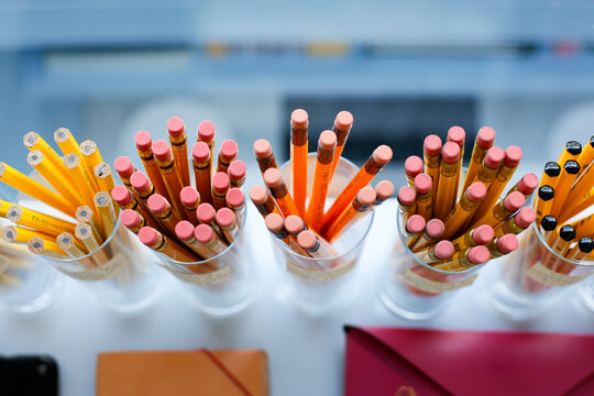 Pencils in Cups on Classroom Desk