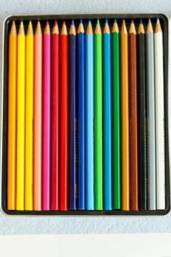 New York, NY. Box of colored pencils in.a row. 